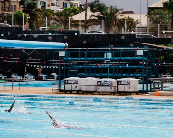 People swimming in the 50 pool