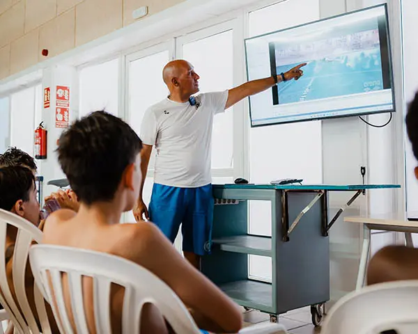 Coach explains the swimming theory